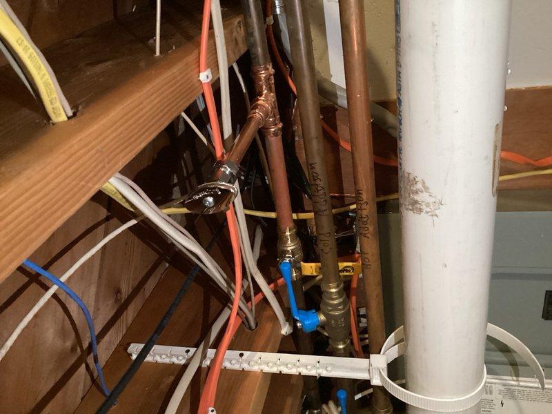 Responded to service call for refrigerator and dishwasher disconnection requiring shut-off valve replacements in preparation for cabinet removal and flooring installation. Upon arrival, shut off main water supply to work area and proceeded with disconnection of appliances. Cut existing water supply piping to both fixtures and properly capped lines to prevent water damage during renovation work. Installed new ball valve on main supply line and added new shut-off valve for refrigerator water line connection, ensuring proper flow control and future serviceability. All copper piping connections were soldered and tested for leaks. Work completed successfully with water supply restored and all connections verified operational.