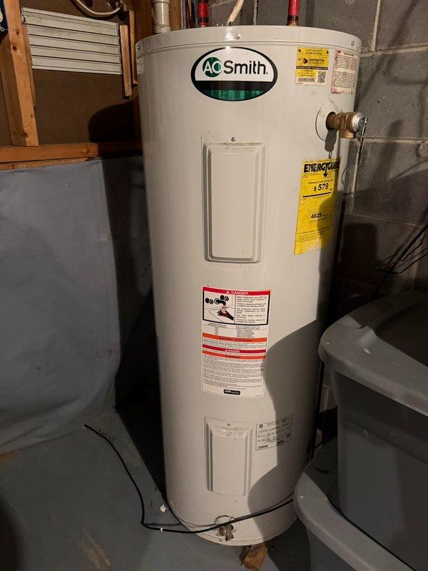 Responded to service call for leaking water heater in basement utility area. Upon arrival, identified an A.O. Smith tanked water heater with active leak originating from the bottom of the unit, indicating tank failure. Confirmed unit was beyond repair due to internal tank corrosion and breach. Proceeded with complete water heater replacement, removing the failed unit and installing new A.O. Smith tanked water heater. Connected copper supply lines with shutoff valves, installed temperature and pressure relief valve with proper discharge piping, and verified all connections for leaks. Tested unit operation, confirmed proper heating function, and ensured compliance with local plumbing codes.