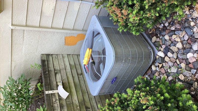 Responded to no cooling complaint on 5-year-old residential AC system. Upon arrival, found evaporator coil and refrigerant line set completely frozen with heavy ice accumulation throughout the air handler compartment. Documented extensive frost buildup on coil, suction line, and drain pan via photographs. System was shut down to allow ice to melt safely. Scheduled follow-up appointment to return once coil has fully thawed to perform refrigerant charge verification, check for airflow restrictions, and diagnose root cause of freezing condition.
