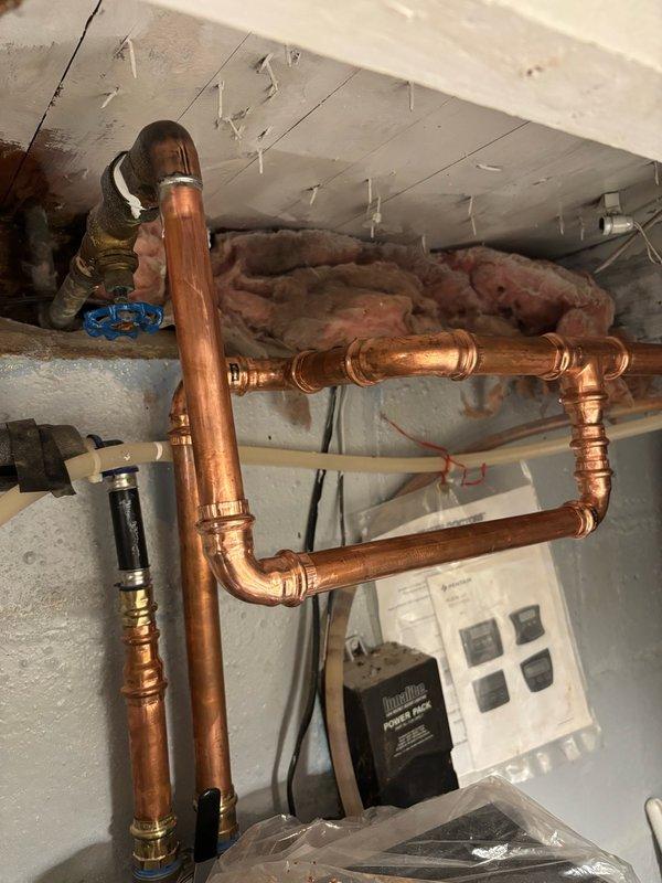 Reinstalled disconnected outdoor faucet using press fittings and performed leak testing for 10 minutes with no leaks detected. Cut out and removed deteriorated galvanized piping from the outdoor water spigot. Additionally, salvaged and installed a handle from an old boiler drain to replace the broken handle on a second exterior faucet, restoring full functionality to both outdoor fixtures.
