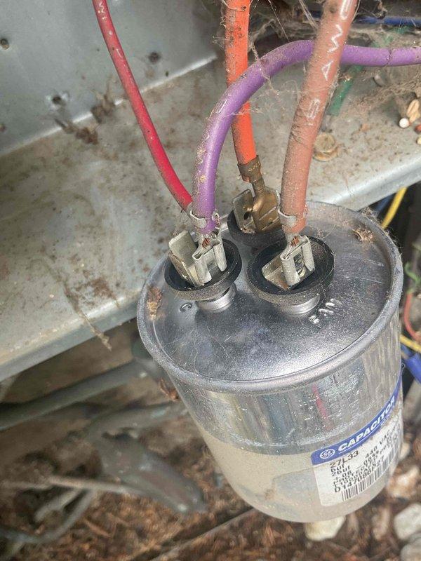 Responded to no cooling call on 25-year-old American Standard air conditioning system where outdoor unit was not running but indoor fan was operational. Diagnosed failed dual-run capacitor and heavily soiled condenser coil restricting airflow. Replaced defective capacitor with proper rated replacement and thoroughly cleaned condenser coil to restore heat transfer efficiency. Verified system operation with digital manifold gauges, confirmed proper pressures and temperatures, and restored full cooling capacity to unit.