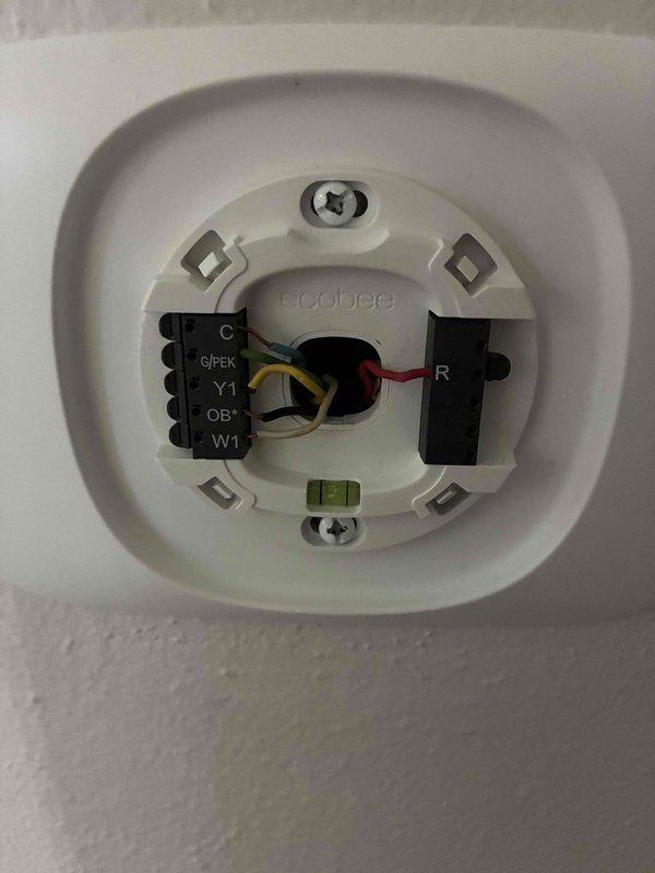 Responded to no cool call on 3-year-old system with complete loss of power to furnace and air conditioning unit. Upon arrival, found Ecobee thermostat display completely dark with no power present at any system components. Diagnosed failed 24V transformer on furnace as primary issue and replaced transformer to restore low voltage power supply. After transformer replacement, conducted system testing and discovered Ecobee thermostat had also failed, specifically the Y terminal which controls compressor operation. Bypassed thermostat and verified air conditioning compressor, condenser fan, and indoor blower motor all operated properly when directly energized, confirming all HVAC equipment functionally sound. Determined faulty thermostat likely caused electrical fault that damaged transformer. System now has proper 24V power supply restored and is ready for operation once new thermostat is installed. Provided thermostat replacement options but customer declined service and elected to self-