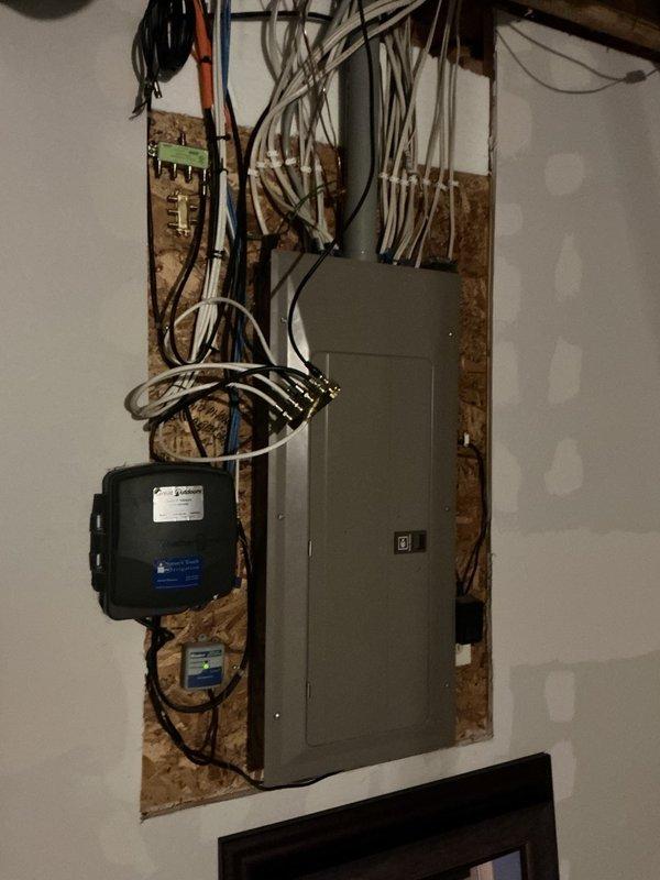 Responded to no cooling complaint on 20-year-old residential air conditioning system. Upon arrival, confirmed indoor blower was operating normally with recently changed air filter and adequate airflow. Proceeded to outdoor condensing unit and observed condenser fan motor running but compressor not operating. Performed electrical diagnostics and tested dual run capacitor, which showed weak capacitance on both fan and compressor terminals. Discussed findings and repair options with homeowner, who elected to proceed with capacitor replacement to restore system operation. Replaced failed dual run capacitor with new unit. Started system and verified proper operation of both condenser fan motor and compressor. Confirmed adequate cooling performance with 19-degree temperature split across evaporator coil.