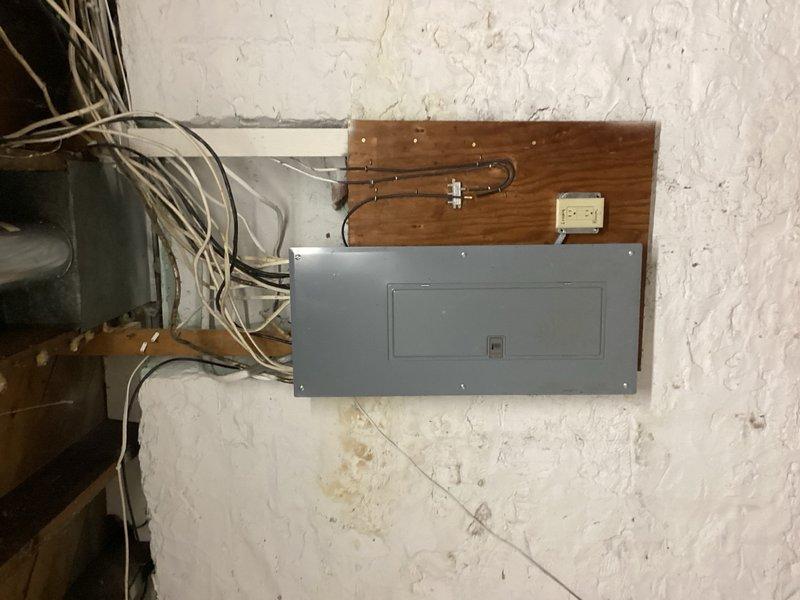 Responded to no cooling complaint on recently installed system. Upon arrival, confirmed outdoor unit was not receiving low voltage call from thermostat, though 240V power was present at condenser. Traced control circuit back to indoor furnace and discovered improper wiring at thermostat wire splice point. Previous installer had incorrectly utilized old 2-wire from legacy air conditioner as the connection between thermostat and furnace instead of new thermostat wire. Reconnected wire nut to proper new thermostat wire Y terminal, restoring low voltage control circuit. Verified system operation with multiple power cycles, confirmed 20-degree temperature split across evaporator coil, and ensured all components functioning correctly. System operating as designed.