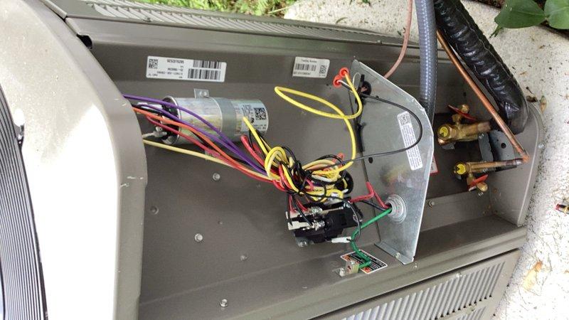 Responded to no cooling complaint on recently installed system. Upon arrival, confirmed outdoor unit was not receiving low voltage call from thermostat, though 240V power was present at condenser. Traced control circuit back to indoor furnace and discovered improper wiring at thermostat wire splice point. Previous installer had incorrectly utilized old 2-wire from legacy air conditioner as the connection between thermostat and furnace instead of new thermostat wire. Reconnected wire nut to proper new thermostat wire Y terminal, restoring low voltage control circuit. Verified system operation with multiple power cycles, confirmed 20-degree temperature split across evaporator coil, and ensured all components functioning correctly. System operating as designed.