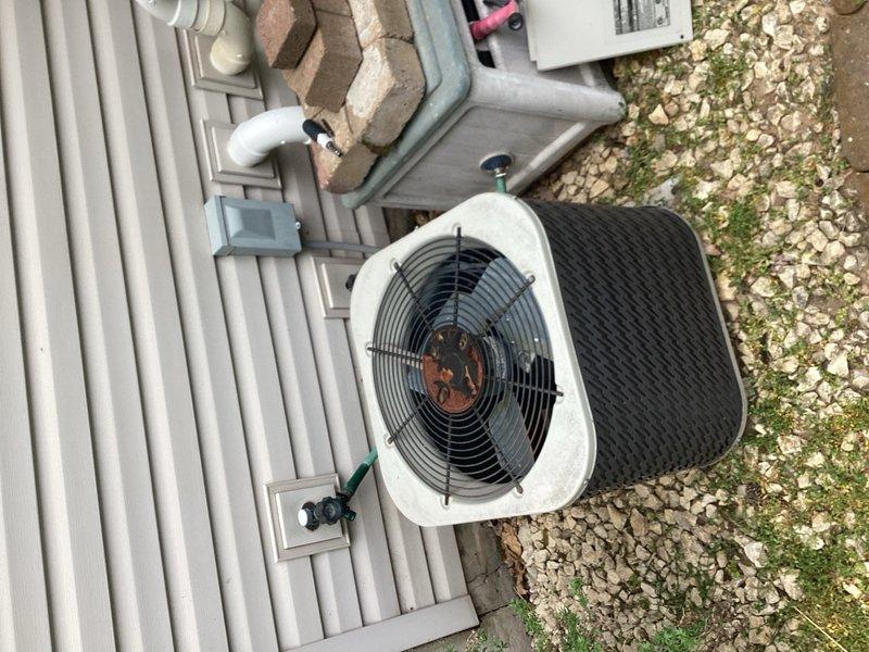 Responded to a no cooling call on a 20+ year old air conditioning system. Upon inspection, discovered rodent damage where mice had chewed through wiring to the condenser fan motor, preventing unit operation. Repaired the damaged wiring and restored electrical connection to the condenser fan. Tested system operation and confirmed proper cooling function restored. Unit shows significant age-related wear and is approaching end of service life. Recommended scheduling furnace inspection before heating season and advised customer that system replacement should be considered in the near future due to age of equipment.