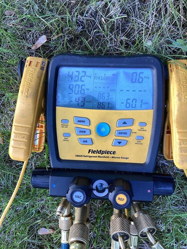 Responded to no cooling complaint on 7-month-old heat pump system unable to maintain temperature below 76°F with outdoor fan not operating. Diagnosed complete refrigerant loss in R-410A system. Performed leak check, recharged system to manufacturer specifications, and added UV dye for future leak detection and monitoring.