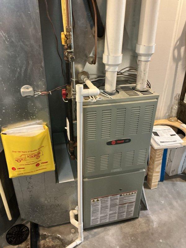Responded to no cooling complaint on 11-year-old residential air conditioning system. Upon arrival, confirmed condenser fan motor operating but no cool air delivery. Verified indoor blower operation and airflow throughout home with recently replaced air filter. Outdoor unit inspection revealed condenser fan running but compressor not engaging. Performed electrical diagnostics and tested dual run capacitor. Found compressor side of capacitor completely failed with no measurable capacitance. Provided repair options and pricing for capacitor replacement. Homeowner elected to source part independently and perform repair himself. Reassembled unit, secured all panels, and disconnected power at breaker per homeowner request to ensure safety during self-service repair.