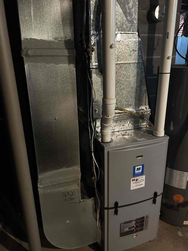Responded to no cooling complaint on 10+ year old system blowing warm air. Diagnosed failed compressor capacitor reading zero microfarads. Replaced defective capacitor with new unit, restoring system operation. Verified proper function with 15-degree temperature split across evaporator coil and confirmed adequate refrigerant charge by observing condensation along suction line.