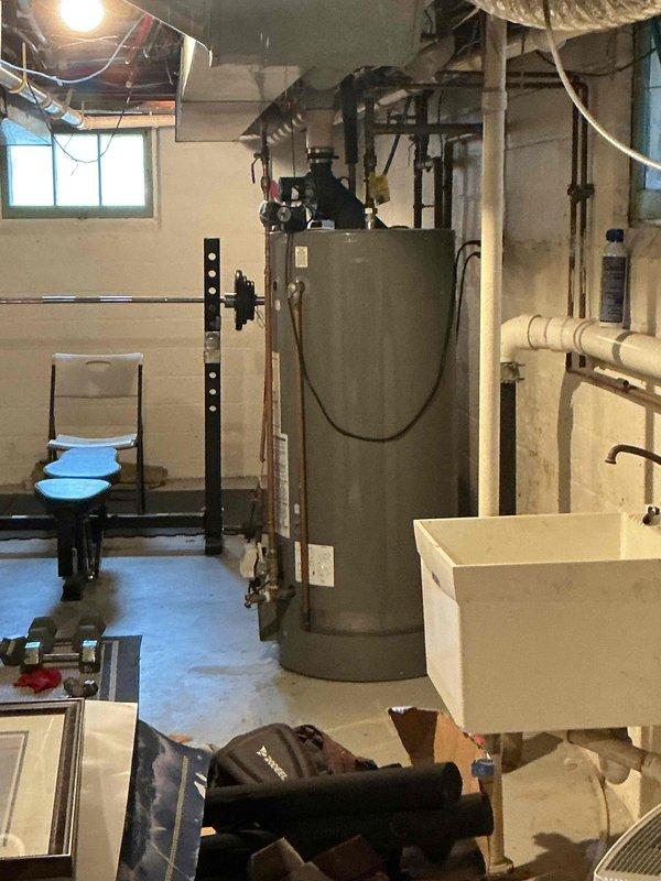 Performed annual maintenance inspection on two residential air conditioning systems: a 17-year-old Lennox unit and a 33-year-old Goodman unit, both utilizing R22 refrigerant. Upon inspection, discovered the Goodman system's suction line frozen solid extending to the outdoor condenser, indicating significant refrigerant loss. Verified proper airflow and confirmed clean filter on both systems. Diagnostics revealed the Goodman unit is critically low on R22 refrigerant and requires system replacement, as refrigerant-side repairs are no longer permitted on this aged equipment. The Lennox system also showed signs of low refrigerant charge, with suction line temperatures dropping below freezing after ten minutes of runtime, indicating imminent freeze-up conditions as ambient temperatures increase. Confirmed adequate temperature differential across the evaporator coil at current conditions, though performance will degrade with warmer weather. All mechanical and electrical components on both sy