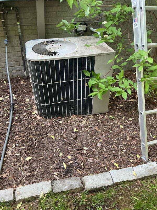 Performed annual maintenance inspection on two residential air conditioning systems: a 17-year-old Lennox unit and a 33-year-old Goodman unit, both utilizing R22 refrigerant. Upon inspection, discovered the Goodman system's suction line frozen solid extending to the outdoor condenser, indicating significant refrigerant loss. Verified proper airflow and confirmed clean filter on both systems. Diagnostics revealed the Goodman unit is critically low on R22 refrigerant and requires system replacement, as refrigerant-side repairs are no longer permitted on this aged equipment. The Lennox system also showed signs of low refrigerant charge, with suction line temperatures dropping below freezing after ten minutes of runtime, indicating imminent freeze-up conditions as ambient temperatures increase. Confirmed adequate temperature differential across the evaporator coil at current conditions, though performance will degrade with warmer weather. All mechanical and electrical components on both sy