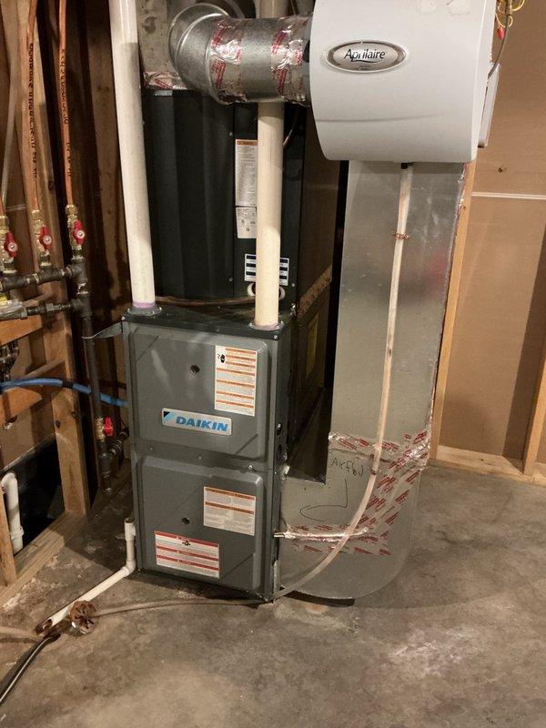 Responded to no cooling complaint on 9-year-old system. Upon arrival, confirmed indoor blower and outdoor fan motor were operational, but compressor was failing to start. Performed diagnostic testing of electrical components and identified failed dual run capacitor preventing compressor engagement. Replaced defective capacitor with proper OEM replacement and installed hard start kit to assist with compressor startup and extend equipment longevity. Performed complete system tune-up including coil cleaning and operational checks. Verified proper system operation with 22-degree temperature split across evaporator coil. System restored to normal cooling operation.