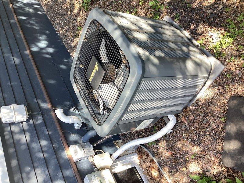 Responded to no cooling complaint and found outdoor unit not operating due to Xcel Energy utility control box malfunction indicated by red warning light. Bypassed utility control box to restore cooling operation and advised customer to contact utility provider for box removal or repair. Performed annual maintenance inspection on condensing unit, cleaned heavily soiled condenser coils, verified refrigerant pressures and electrical components, and confirmed system operating within normal parameters upon completion.
