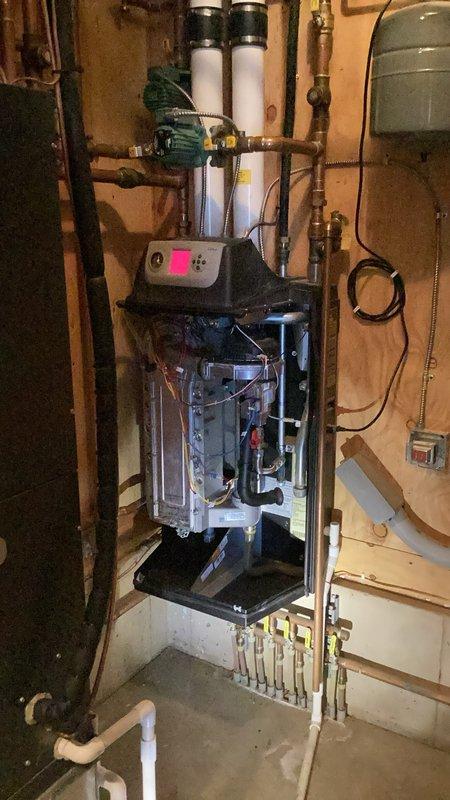 Installed check valve on cold water supply line to support recirculating pump operation on residential heating system. Assessed plumbing configuration in basement mechanical room and provided quote for future water line extension to refrigerator location. HVAC technician also present on site for concurrent service evaluation.