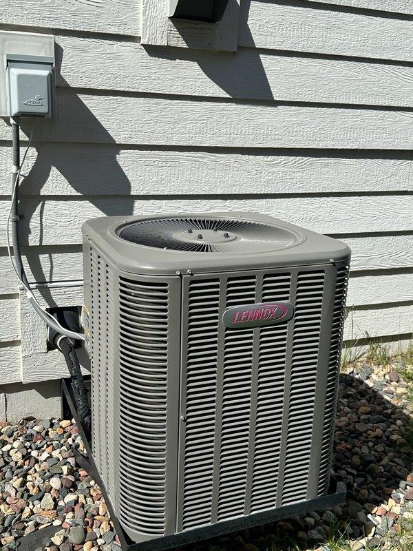 Responded to no cooling complaint on 11-year-old residential air conditioning system. Upon arrival, confirmed unit was blowing warm air with no visible condensation at outdoor unit. Verified thermostat was properly calling for cooling mode. Performed comprehensive diagnostic inspection of outdoor condenser unit including visual examination of coil condition, capacitor operation, and refrigerant charge level. System found to be significantly low on refrigerant. Proceeded to indoor air handler where evaporator coil was discovered to be partially iced up, consistent with low refrigerant charge. Based on ice formation pattern and refrigerant loss, diagnosed probable refrigerant leak in system. Homeowner reported that another HVAC contractor had previously added 4 pounds of refrigerant to system, confirming ongoing leak issue. Presented repair options including leak detection dye injection and refrigerant recharge to temporarily restore cooling operation. Homeowner declined repair services 