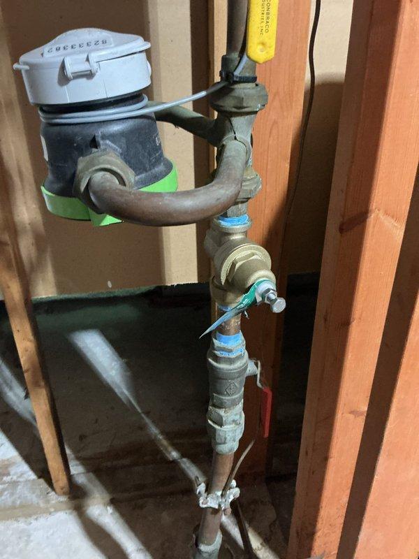 Responded to service call for recently installed water heater with water accumulation around base of unit. Performed comprehensive leak testing and pressure diagnostics on tankless water heater system. Inspected temperature and pressure relief valve, overflow piping, and all connection points. Testing confirmed proper system pressure within normal operating parameters. Determined moisture was condensation related to recent installation rather than active leak. Verified all fittings, valves, and connections were secure with no signs of active water seepage.