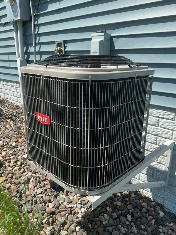 Responded to no cooling complaint on 5-year-old Bryant residential air conditioning system. Upon arrival, confirmed system was off and restarted unit for diagnostic evaluation. Observed outdoor condenser fan motor and compressor failing to energize. Performed electrical component testing and identified failed dual run capacitor with zero capacitance reading, preventing both fan and compressor operation. Manually rotated condenser fan blade to verify motor functionality; fan motor started and continued running, confirming motor was operational and capacitor was sole failure point. Replaced defective capacitor with new unit to manufacturer specifications. Cycled system through complete startup sequence and verified proper operation of all components. Condenser fan motor and compressor both energized correctly and ran continuously without issue. Proceeded to indoor air handler location and confirmed blower motor operation and adequate airflow. Inspected air filter and found acceptable con