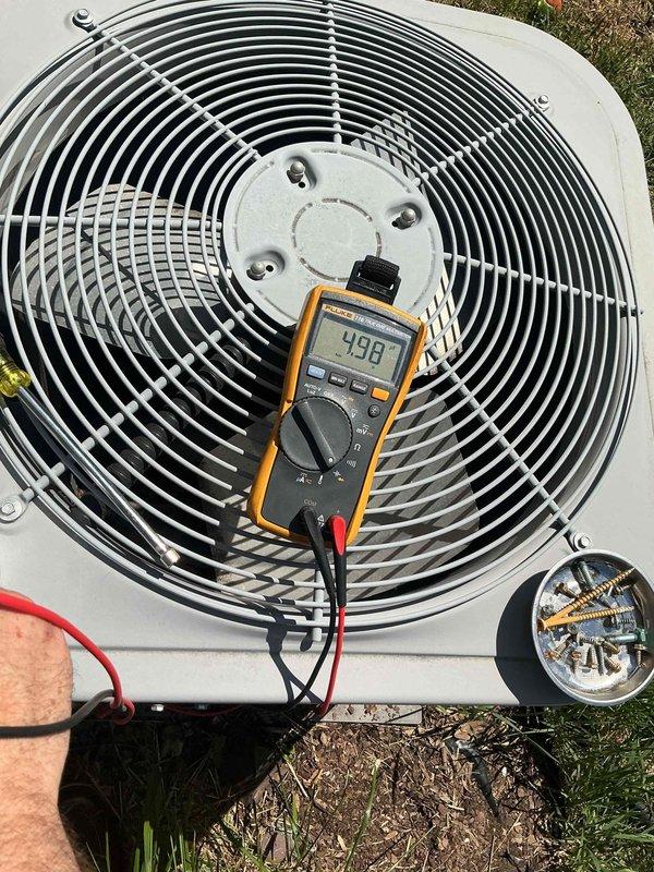 Responded to no cooling call on 11-year-old Carrier air conditioning system. Upon arrival, diagnosed dual capacitor failure affecting both compressor and condenser fan motor circuits. Replaced failed dual run capacitor, restoring system operation. Verified refrigerant charge within manufacturer specifications, confirmed proper amp draws on compressor and fan motor, and inspected condenser coil finding acceptable cleanliness. Contactor tested and found operational. Replaced furnace filter with customer-supplied media. Measured supply/return air temperature differential at approximately 20 degrees, confirming adequate system performance. Advised customer that extended operation on weakened capacitor may have caused cumulative damage to compressor and fan motor, potentially shortening remaining service life. Discussed repair versus replacement options given system age and condition.