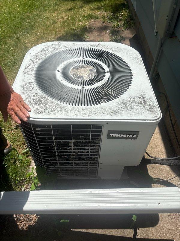 Responded to no cooling complaint on residential Tempstar air conditioning system manufactured in 1988. Upon arrival, performed diagnostic evaluation of outdoor condensing unit. System exhibited complete failure to provide cooling to entire home. Diagnostic testing confirmed compressor failure, rendering the unit inoperable. Given the age of the equipment at 36 years old and the cost of compressor replacement versus system efficiency, recommended full system replacement. Documented unit condition with photographs showing exterior condenser with accumulated debris and wear consistent with age. Comfort advisor contacted to provide replacement options and system upgrade recommendations to homeowner.