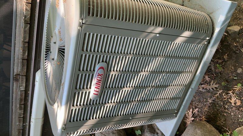 Responded to a no cooling complaint on a 2-year-old Lennox air conditioning system that was blowing hot air and had ceased operation the previous evening. Upon arrival, diagnosed the issue by testing the outdoor disconnect and discovered failed fuses—one reading 0.9 ohms and the other showing an open line (OL). Replaced the defective disconnect fuses, restoring power to the condenser unit and returning the system to normal cooling operation.