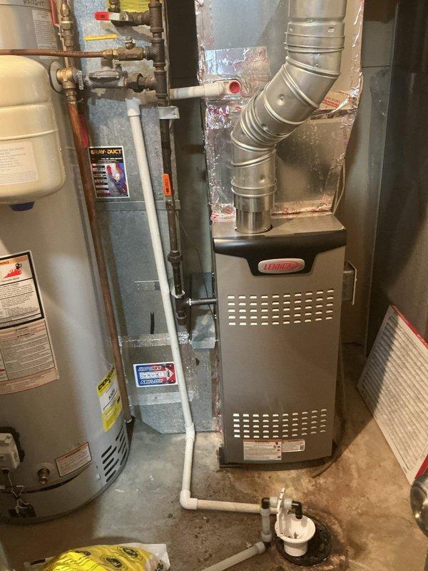 Responded to no cooling complaint on 6-year-old Lennox system that had frozen up the previous day. Upon arrival, unit had thawed and was operational. Performed diagnostic testing and found restrictive air filter which was removed. Verified fan speed settings were correct. Monitored subcooling readings which initially fluctuated between 10-17°F before stabilizing at 10-12°F within acceptable range. Confirmed proper temperature split across evaporator coil. Checked suction line temperature and saturated suction temperature, both reading normal. Evaluated potential TXV or filter drier restriction by measuring temperature differential across filter drier, which showed 2°F difference indicating proper flow. Verified TXV insulation was installed correctly. All system parameters returned to normal operating conditions after allowing adequate runtime. Recommended customer switch to MERV 5 rated filter and maintain monthly replacement schedule to prevent future freeze-ups due to airflow restric