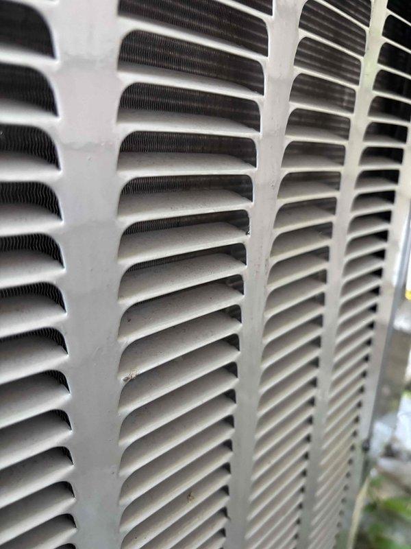 Responded to no cooling complaint on residential HVAC system. Upon arrival, verified thermostat calling for cooling and checked indoor unit components including filter, condensate drain, and blower motor, all found operational. Proceeded to outdoor unit where condenser fan motor operated but compressor failed to start. Diagnosed failed dual-run capacitor (40+5 MFD) preventing compressor operation and replaced with new capacitor. During inspection, found outdoor condenser coil heavily soiled with debris, restricting airflow and reducing system efficiency. Thoroughly cleaned and rinsed condenser coil to restore proper heat transfer. After repairs, verified system operation with compressor running properly. Measured temperature split across evaporator coil at 20 degrees, confirming adequate cooling performance. System restored to normal operation with proper airflow and refrigeration cycle functioning as designed.