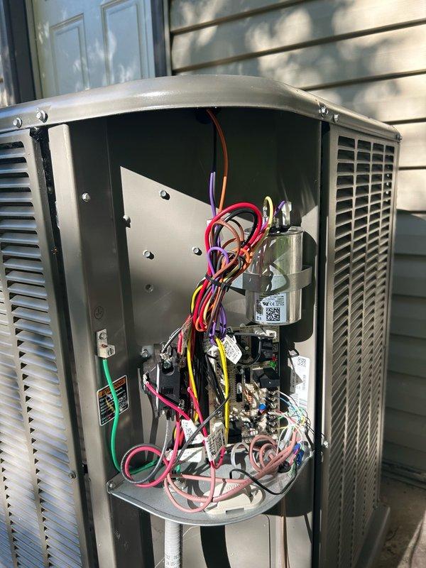 Responded to no cooling complaint on Lennox heat pump system installed approximately six months prior. Upon arrival, verified indoor unit was sending cooling call with 24VAC present at Y1 to common at outdoor board. Outdoor unit would not energize but ran when contactor was manually engaged.

Performed systematic diagnostic testing of outdoor unit components. Checked contactor coil and confirmed proper resistance, ruling out open coil. Measured voltage across high and low pressure switches reading 0VAC, confirming both switches were closed and passing signal. Tested voltage from Y1 out to common and found 0 volts, indicating outdoor control board was not energizing contactor output circuit despite receiving proper input signal from indoor unit.

Performed jumper test from Y1 input to Y1 output terminal, which successfully pulled in contactor and allowed unit to operate normally. This confirmed contactor, coil wiring, and all load-side components were functional. Verified resistance rea