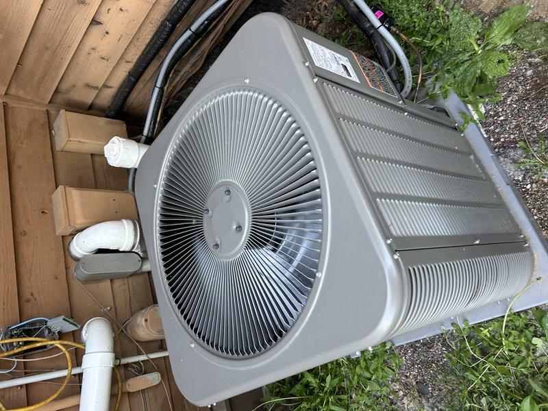 Responded to no cooling complaint on two-month-old dual-zone Lennox system. Upon arrival, found one condensing unit non-operational due to failed condenser wire connection. Ran new electrical wire to affected unit, restoring power and operation. Tested both systems and confirmed proper function. Identified restricted airflow issues caused by closed vents throughout home and dirty air filters requiring replacement. Cleared airflow error codes after verifying both outdoor units operating correctly with adequate refrigerant charge and proper electrical supply.