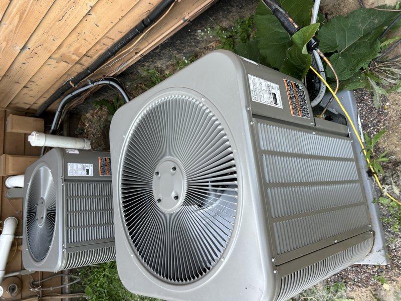 Responded to no cooling complaint on two-month-old dual-zone Lennox system. Upon arrival, found one condensing unit non-operational due to failed condenser wire connection. Ran new electrical wire to affected unit, restoring power and operation. Tested both systems and confirmed proper function. Identified restricted airflow issues caused by closed vents throughout home and dirty air filters requiring replacement. Cleared airflow error codes after verifying both outdoor units operating correctly with adequate refrigerant charge and proper electrical supply.