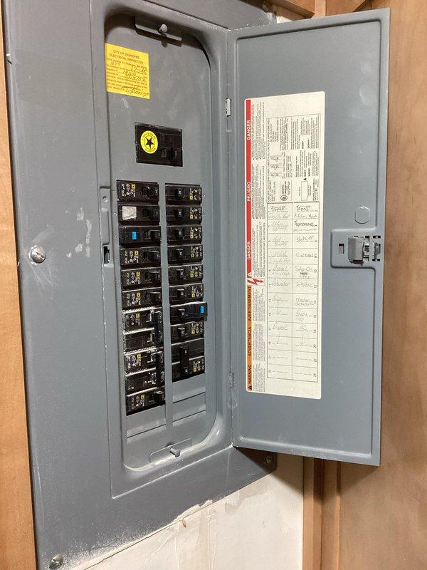 Responded to no cooling call on recently installed 2024 AC system. Found main breaker tripping even with outdoor disconnect removed, indicating electrical issue upstream of HVAC equipment. Inspected electrical panel and confirmed breaker fault independent of AC system operation. Recommended scheduling licensed electrician to diagnose and repair electrical panel issue before system can be safely restored to operation.