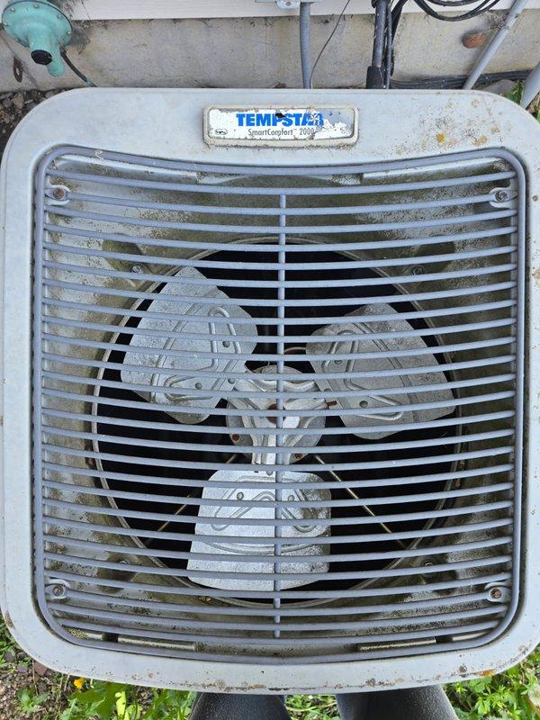 Responded to no cooling call on 15+ year old Tempstar SmartComfort 2000 R22 system. Found mice had infiltrated outdoor unit causing contactor to fail - debris prevented contacts from closing properly. Cleaned contactor assembly and removed all rodent material from unit. Checked system operation and measured refrigerant pressures - unit slightly low on R22 but achieving 20-degree temperature split across evaporator coil. Noted condenser coil significantly plugged on back side, restricting airflow. Customer elected to defer coil cleaning and operate unit as-is to extend remaining service life. System restored to operational status but advised of potential freeze-up risk due to low refrigerant charge. Prepared estimate for contactor replacement as preventive measure given age of component and recent contamination. Unit functional at time of departure.