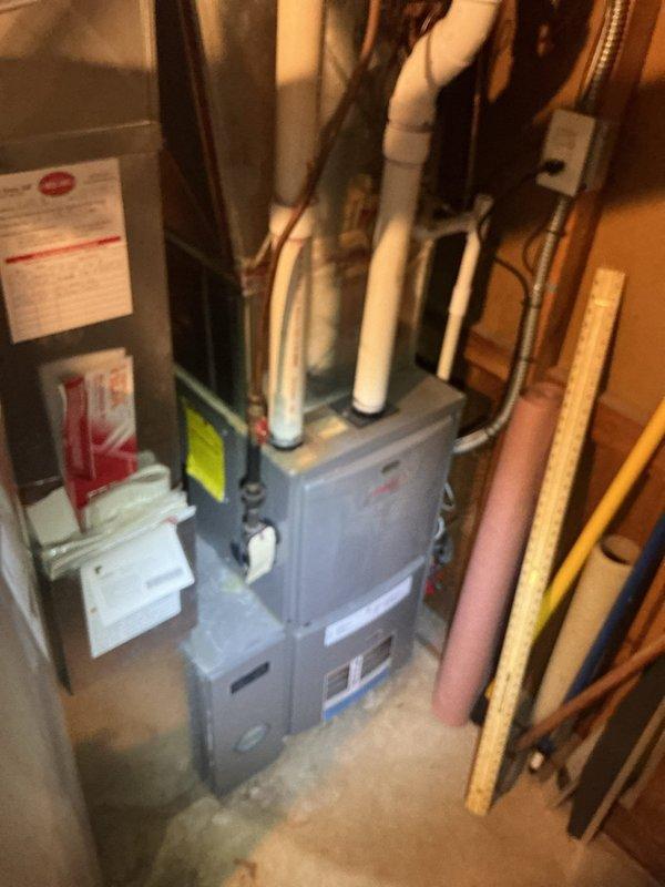 Responded to service call for reported water leak from wall near toilet in residential basement. Upon arrival, accessed mechanical room and opened wall access panel to inspect plumbing infrastructure. Conducted thorough visual inspection of all visible water supply lines, drain pipes, and connections within the wall cavity and surrounding basement area. Examined toilet supply line, shut-off valve, and wall penetrations for signs of active leakage or moisture. Inspected HVAC equipment area and associated piping for potential water sources. Despite comprehensive investigation of all accessible plumbing components, unable to locate active leak or identify source of reported water intrusion. No visible water damage, moisture accumulation, or dripping observed during service visit. House main water shut-off valve location confirmed in family room for future reference. Additionally provided estimate for kitchen or bathroom faucet replacement as requested by customer, which was declined at th