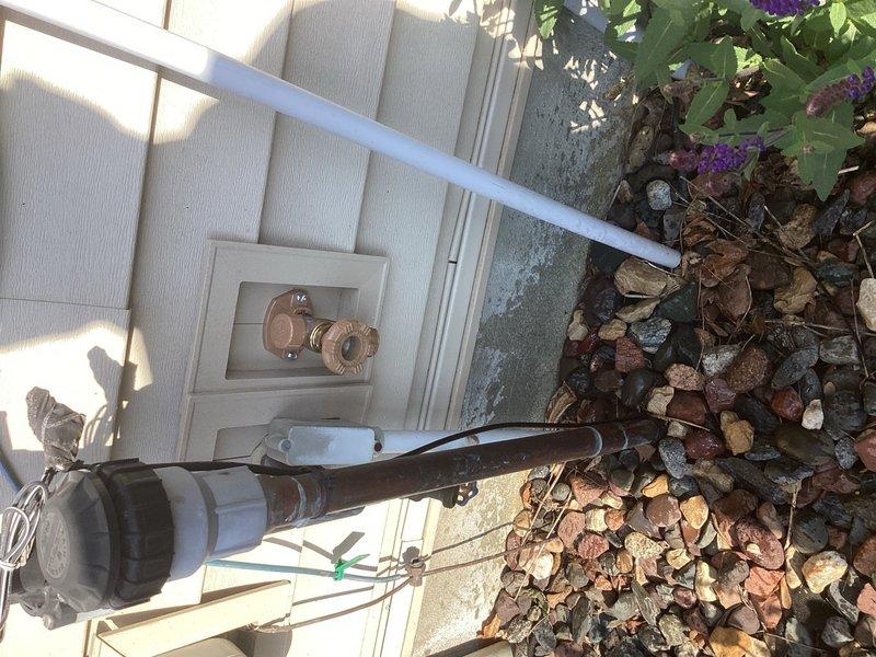 Responded to service call for outdoor hose bibb that would not shut off properly. Upon arrival, confirmed active leak at exterior spigot assembly. Accessed shutoff valve from interior location through unfinished space to isolate water supply. Removed failed hose bibb from exterior wall penetration and inspected mounting hardware and pipe connections. Installed new frost-free hose bibb with proper sealing and secured unit within existing recessed wall box. Restored water supply and tested new fixture under full pressure to verify complete shutoff functionality with no leakage. Confirmed proper drainage and operation of replacement unit.