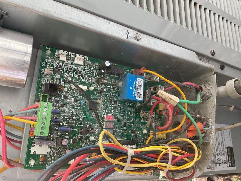 Responded to no cooling call on system approximately ten years old. Upon arrival, found EC error code displaying at air handler control board located in attic garage space. Performed comprehensive diagnostic procedures including voltage testing through Bluon diagnostic protocol to isolate the fault. Testing confirmed failed ECM blower motor module. Due to confined workspace conditions in attic garage installation area, scheduled return visit to complete ECM module replacement.