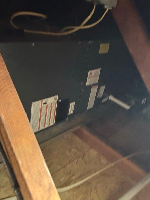 Responded to no cooling call on system approximately ten years old. Upon arrival, found EC error code displaying at air handler control board located in attic garage space. Performed comprehensive diagnostic procedures including voltage testing through Bluon diagnostic protocol to isolate the fault. Testing confirmed failed ECM blower motor module. Due to confined workspace conditions in attic garage installation area, scheduled return visit to complete ECM module replacement.