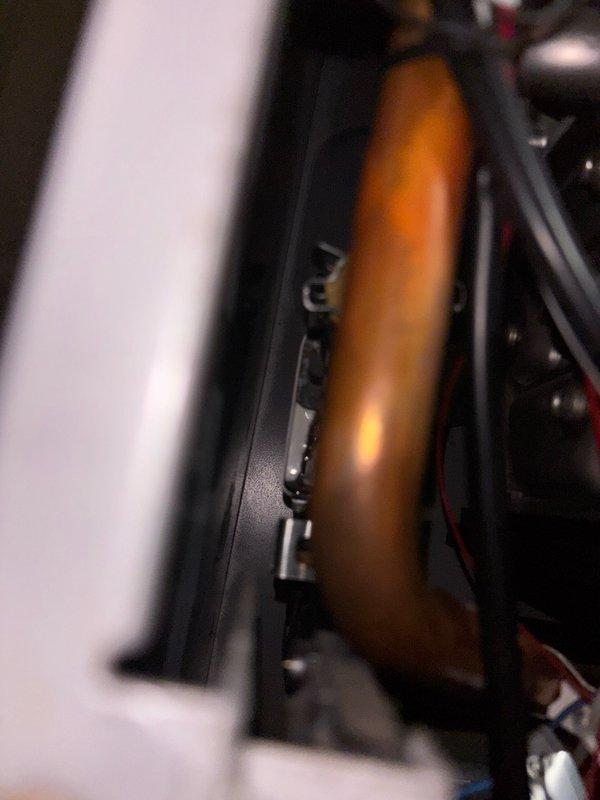 Responded to service call for leaking tankless water heater that was tripping GFCI outlet. Located unit in utility room and confirmed Westinghouse tankless water heater model with visible water leak. Performed visual inspection and identified slow drip originating from internal solenoid valve positioned directly above inlet gas line. Conducted electrical testing to verify GFCI tripping issue and confirmed correlation with internal leak condition. Documented leak location and captured photographic evidence of affected solenoid component and electrical connections. Contacted Westinghouse technical support line to initiate warranty case and obtain manufacturer guidance for solenoid replacement procedure. Received case initiation instructions via email from manufacturer support team. Job paused pending manufacturer response and parts availability determination, as internal component replacement requires factory authorization and specific replacement procedures for this tankless unit model.