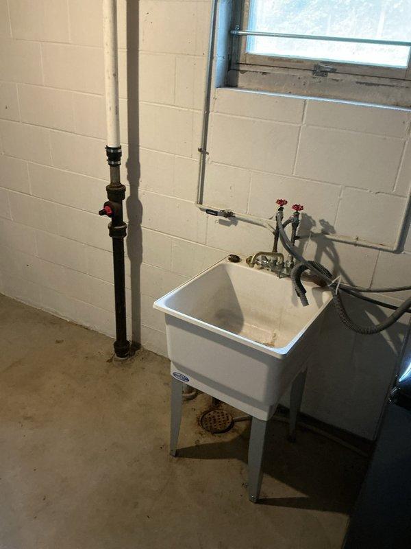 Responded to a basement floor drain backup occurring when the washing machine discharged, causing water to overflow from the utility sink onto the floor with extremely slow drainage taking approximately two hours to clear. Upon arrival, verified the complaint and tested all toilets, confirming proper drainage throughout the home, which indicated the blockage was isolated to the floor drain line rather than the main sewer line. 

Cabled the floor drain line to clear the obstruction and successfully restored flow. Extracted a large accumulation of lint from the drain line, which was the primary cause of the blockage. Following the cable work, performed multiple flow tests by filling and emptying the laundry tub several times to ensure complete clearance and proper drainage function. The floor drain is now operating at normal capacity with no backup or slow drainage issues.