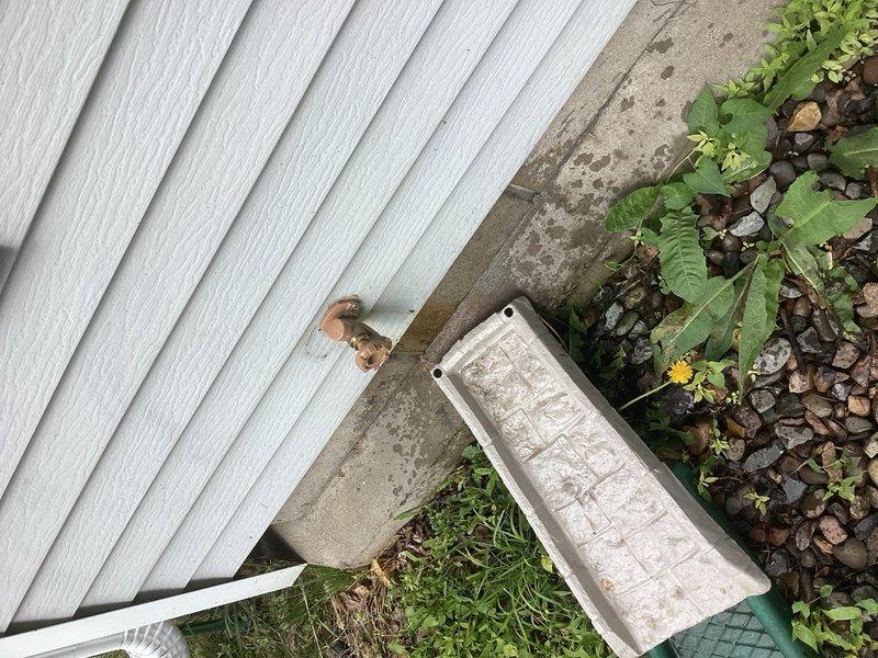 Responded to emergency water leak at exterior hose bibb that was actively pouring water, requiring immediate shutdown of main water supply to the property. Removed failed outdoor spigot assembly and accessed copper supply line through foundation wall. Installed new frost-free hose bibb with proper seating and connection to existing copper piping, ensuring watertight seal at all connection points. Restored water service to property and verified no leaks at installation site upon pressurization.