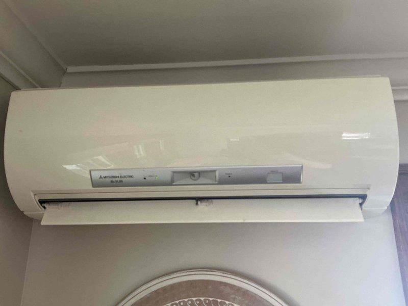Responded to no cooling complaint on Mitsubishi Electric ductless mini-split heat pump system with multiple indoor head units. Diagnosed intermittent operation issue on one of three wall-mounted air handlers that was powering on without thermostat call, requiring circuit breaker shutdown to control. Consulted with manufacturer technical support and determined issue was caused by infrared sensor interference. Applied insulation tape over IR sensor to block interference and manually shut down affected head unit. Instructed occupant on temporary workaround to remove tape if zone cooling is needed, then reapply after use. System remains operational on other two zones; monitoring required to determine if permanent repair or head unit replacement will be necessary if issue persists.