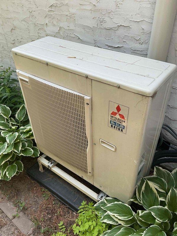 Responded to no cooling complaint on Mitsubishi Electric ductless mini-split heat pump system with multiple indoor head units. Diagnosed intermittent operation issue on one of three wall-mounted air handlers that was powering on without thermostat call, requiring circuit breaker shutdown to control. Consulted with manufacturer technical support and determined issue was caused by infrared sensor interference. Applied insulation tape over IR sensor to block interference and manually shut down affected head unit. Instructed occupant on temporary workaround to remove tape if zone cooling is needed, then reapply after use. System remains operational on other two zones; monitoring required to determine if permanent repair or head unit replacement will be necessary if issue persists.