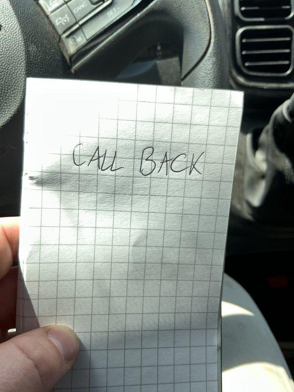 Completed phone follow-up regarding previous estimate request. Customer has demolished property down to the studs and inquired about scheduling work to proceed with project. Documented callback request and contact information for estimate discussion. Photographed reminder note to ensure timely follow-up communication is completed.