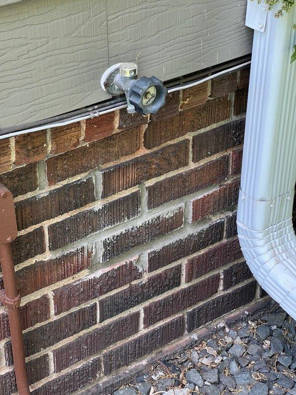Responded to service call for malfunctioning exterior hose bib that was seized and inoperable. Upon assessment, determined existing spigot required complete replacement due to frozen valve mechanism. Procured and installed 18-inch frost-free sillcock to accommodate wall depth and provide proper drainage angle. Removed failed fixture, prepared mounting surface on brick exterior, and secured new anti-siphon outdoor faucet with appropriate weatherproofing measures to prevent future water intrusion.