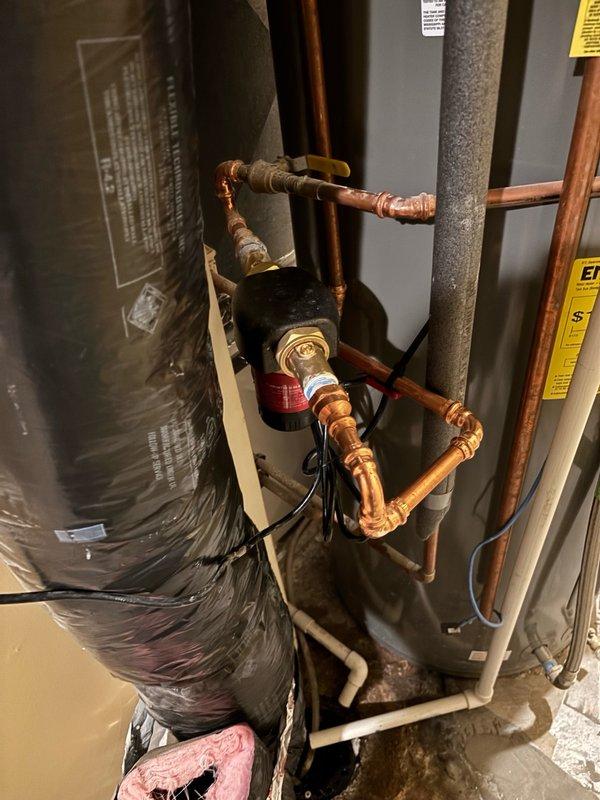 Responded to follow-up service call regarding recirculation pump on tanked water heater producing excessive noise and cycling irregularly. Upon inspection, discovered pump was improperly oriented and configured on incorrect operational setting, causing unit to turn on and off every few seconds. Referenced manufacturer installation manual to verify proper specifications. Rotated pump 180 degrees to correct orientation per manufacturer guidelines and adjusted control settings from intermittent to continuous run mode. Reinstalled pump with proper configuration, tested system operation, and confirmed unit now runs quietly and continuously as designed. System restored to proper working order in accordance with manufacturer recommendations.