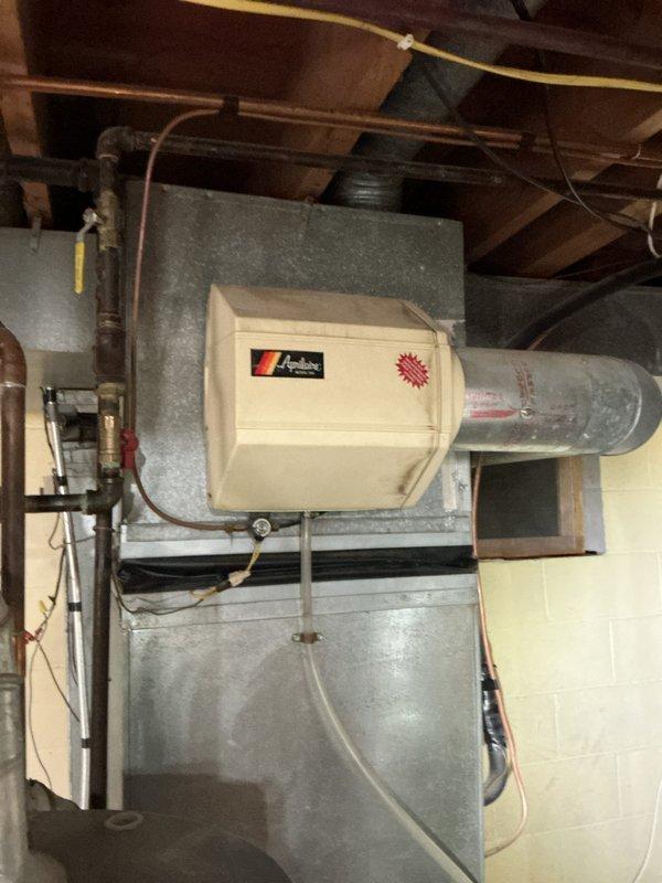 Completed comprehensive plumbing inspection of vacant residential property and documented multiple code deficiencies and hazardous conditions. Provided detailed photographic documentation of bathroom vanity fixture with PVC drain assembly and HVAC system plumbing connections, then prepared separate itemized estimates categorizing repairs by hazardous violations versus below-minimum code requirements for property compliance.