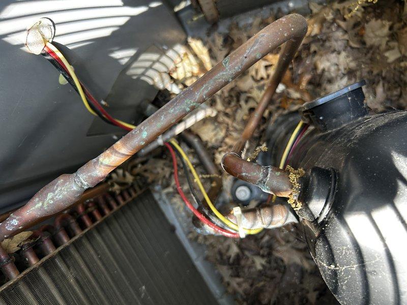Responded to no cooling call on 20-year-old residential air conditioning system. Upon arrival, found condenser fan motor not operating while compressor was running. Diagnosed failed dual run capacitor preventing fan motor operation. Replaced defective capacitor and verified proper fan motor operation.

Performed comprehensive maintenance service including condenser coil cleaning, condensate drain line clearing, and air filter inspection. Conducted system performance testing with refrigerant pressure measurements on suction line, confirming proper operating pressures and adequate temperature differential across evaporator coil. System restored to full cooling operation with no refrigerant leaks or freeze-up conditions detected. Documented equipment condition with photos showing corroded copper refrigerant lines and overall unit wear consistent with age. Advised customer of condenser fan motor condition for future consideration. Unit operating normally at departure.