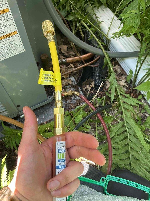 Responded to no cooling complaint on 1.5-year-old Unico air handler with Daikin condenser system. Found unit in lockout mode due to complete loss of refrigerant charge. Recharged system with refrigerant and added UV dye to facilitate future leak detection. Customer advised that follow-up leak search will be required to identify and repair refrigerant leak source.