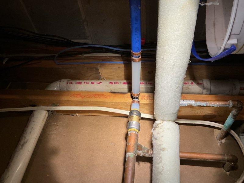 Responded to a leak on a recently installed tanked water heater that was still producing hot water but had active water seepage at a connection point. Upon inspection, identified a heavily corroded fitting that had not been replaced during the initial installation. Removed and replaced the compromised fitting with new hardware, then performed a thorough leak check to verify proper seal and connection integrity throughout the system.