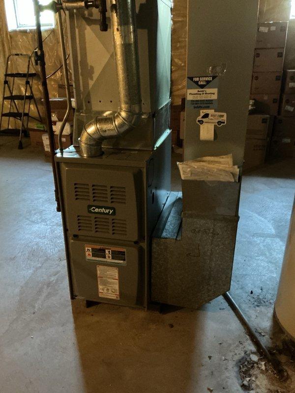 Responded to no cooling complaint on aging AC system. Upon inspection, discovered air filter completely clogged with white ultrasonic humidifier dust causing high-pitched whistling and excessive blower noise. Removed contaminated filter, which immediately eliminated whistling and reduced motor noise. Proceeded to outdoor unit and performed electrical diagnostics, finding capacitor testing weak and slightly out of specification but still functional. Cleaned condenser coil and cycled system for performance verification. Unit achieved proper cooling with 20° temperature split across coil. Installed temporary filter and provided estimate for capacitor replacement. System operational at time of departure, advised discontinuing use of ultrasonic humidifier to prevent future filter contamination and airflow restriction.