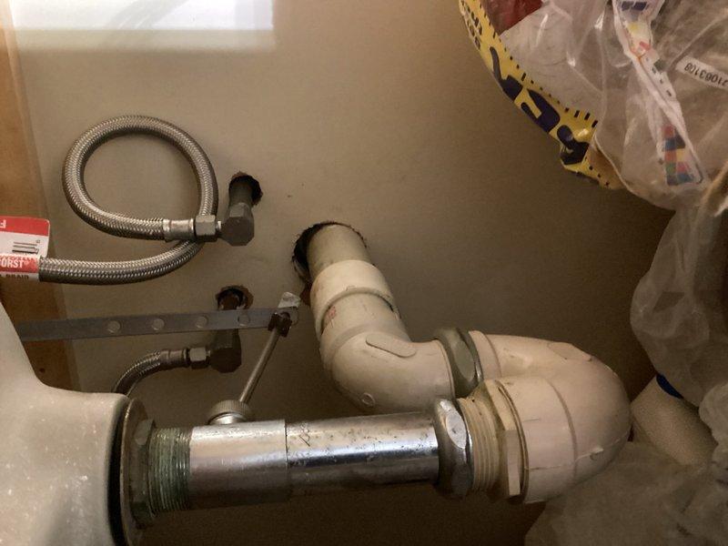 Completed comprehensive plumbing inspection as part of friends and family rewards program. Documented under-sink plumbing configuration including flexible supply lines, PVC P-trap assembly, and drain connections, as well as ceiling-mounted fixtures and safety devices. All components photographed for record-keeping purposes, with HVAC inspection also scheduled for this visit.