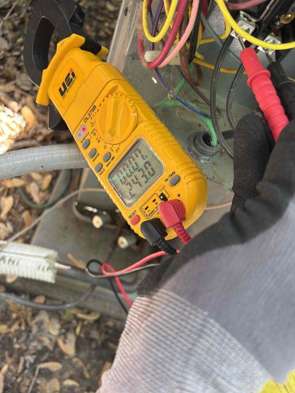 Responded to callback for no cooling condition with system failing to reach setpoint and condenser not operating. Verified thermostat calling for cooling, then checked outdoor unit and confirmed no 24V signal present. Inspected indoor unit components including filter, drain, condensate pump, and blower motor—all found satisfactory. Tested control circuit between C and Y terminals with no call signal detected. Performed jumper test from R to Y, which successfully energized the air conditioning system. Reset system and retested cooling cycle, system responded normally. Cycled cooling operation multiple times with proper function confirmed. Retrieved diagnostic error code P15 indicating ECM blower motor communication failure. Tested electrical components using digital multimeter to verify voltage readings and component integrity. Recommended warranty replacement of ECM blower motor and control board to resolve intermittent communication issue causing system failures. Submitted parts order